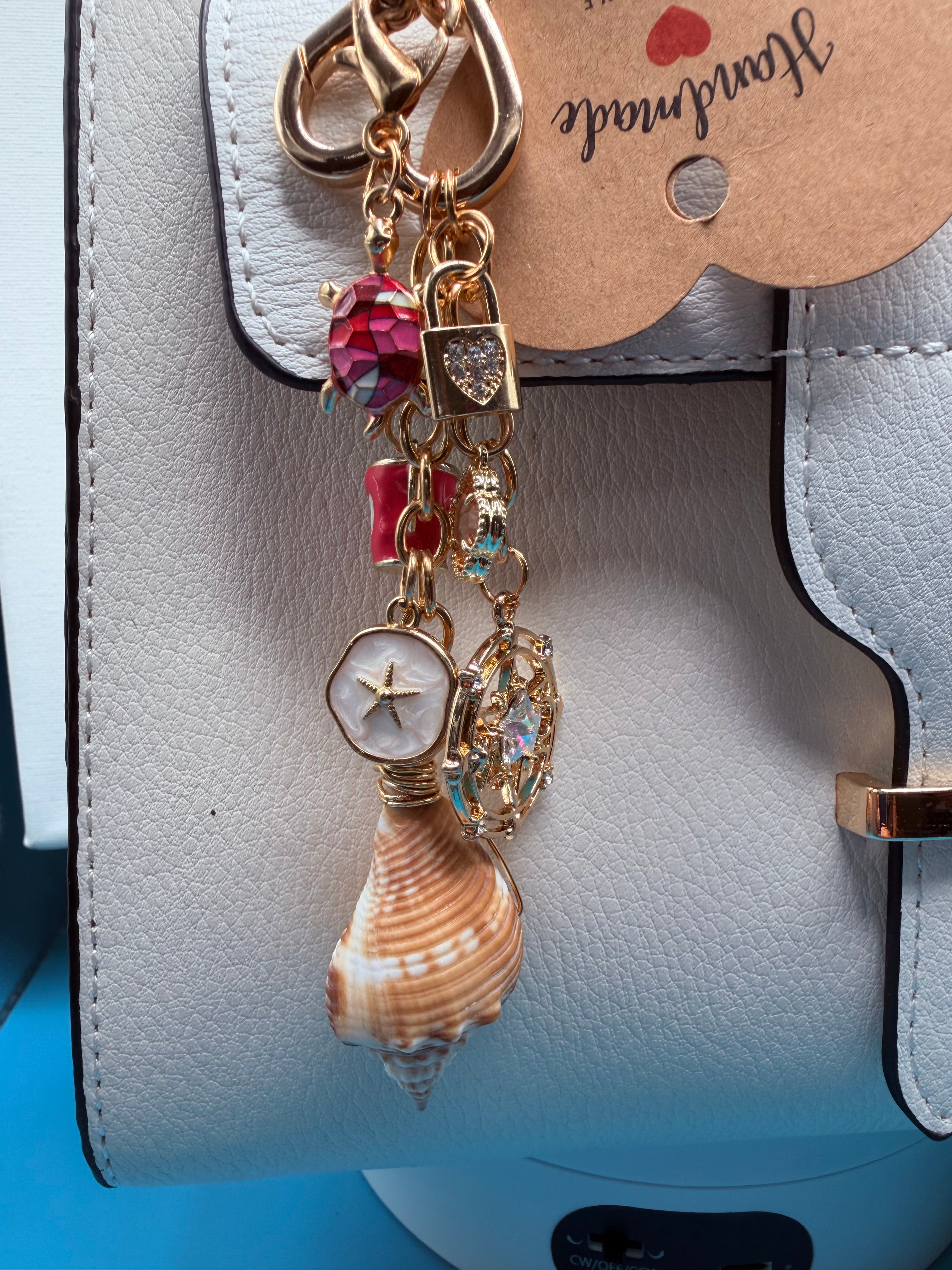 Conch Shell Compass Charm Cluster charm cluster close-up