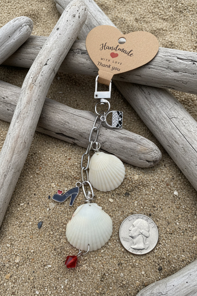 Shells and Stilettos scallop shell bag charm close-up showing stiletto heel charm and red heart
