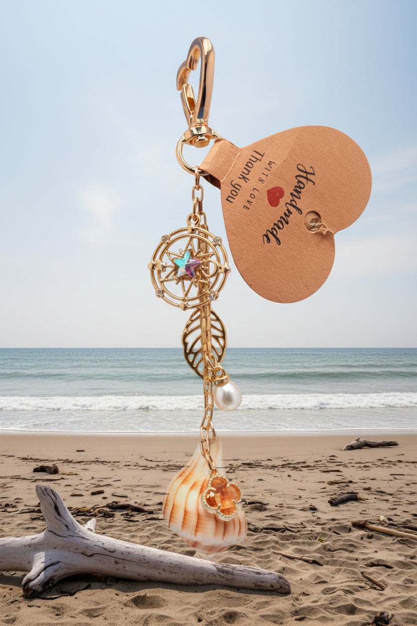 Celestial Shores Lightning Whelk Shell Bag Charm With Gold Compass Star Charm