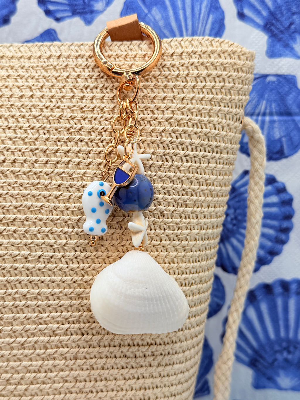Florida ark shell bag charm on woven straw tote bag close-up showing handmade with love thank you card