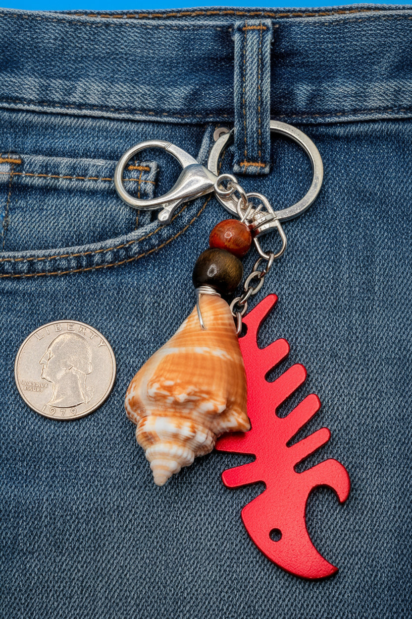 Florida conch shell red fishbone bottle opener keychain styled on woven straw tote bag with blue shell print background