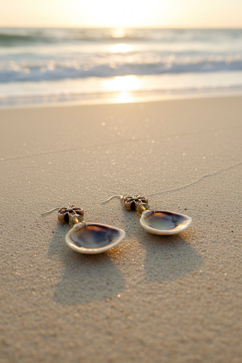 Ribbed venus clam shell earrings on display stand with dime for scale