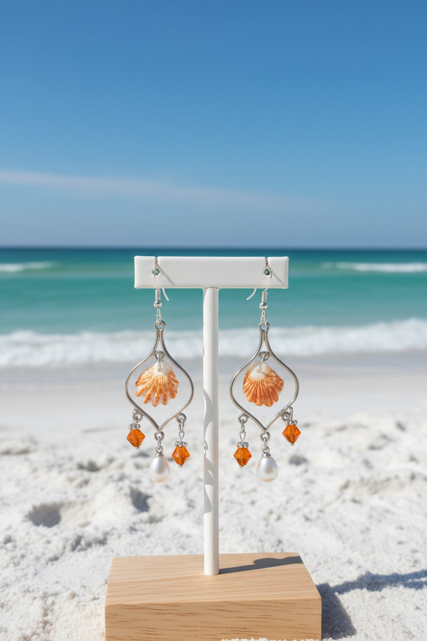 Close-up of kitten paw shell chandelier earring showing shell and bead detail