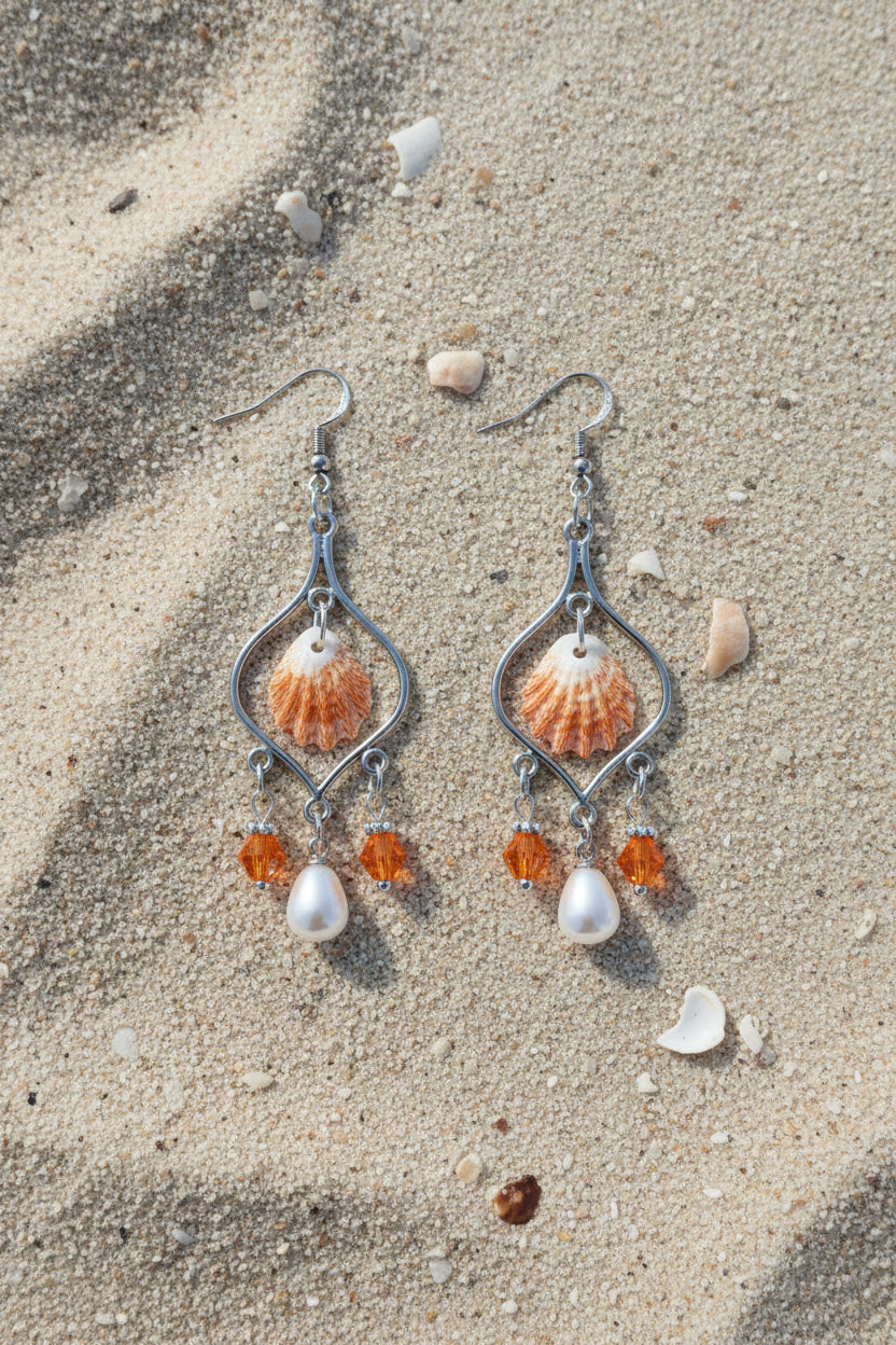 Kitten paw shell chandelier earring with quarter for scale on blue background