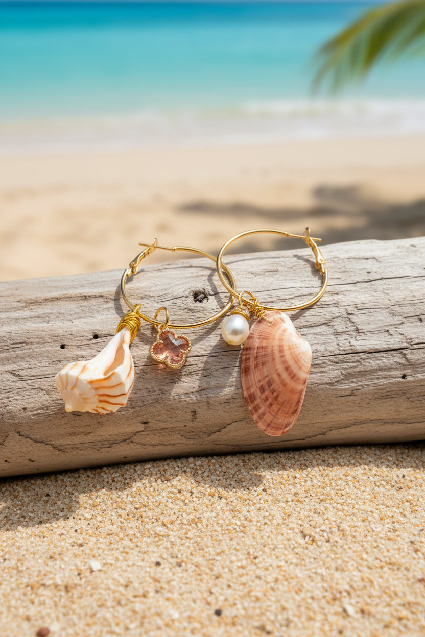 Mismatched shell hoop earrings on white surface flat lay with both shells visible