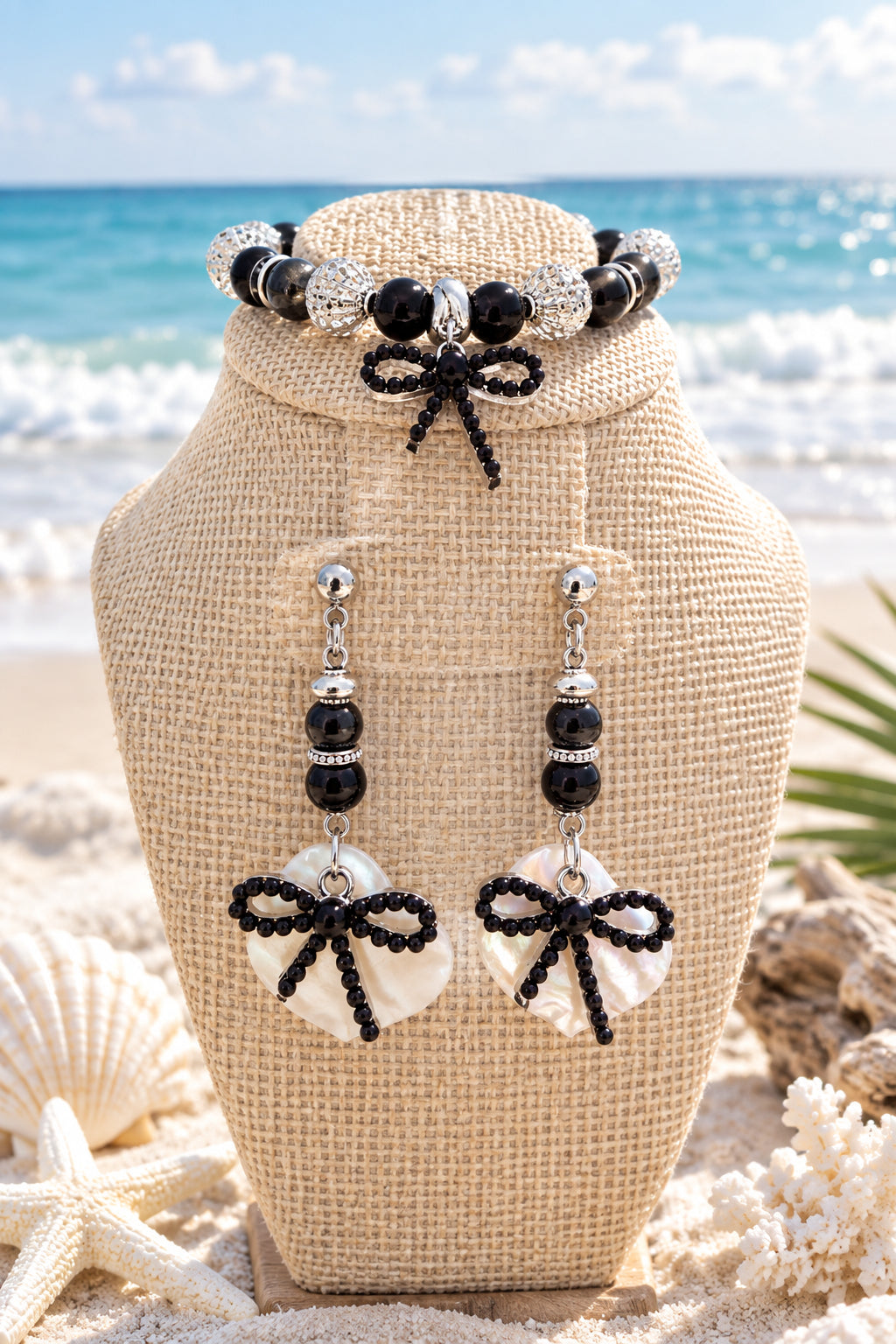 Patterned natural shell pendant with black beads and sparkling silver-tone accents