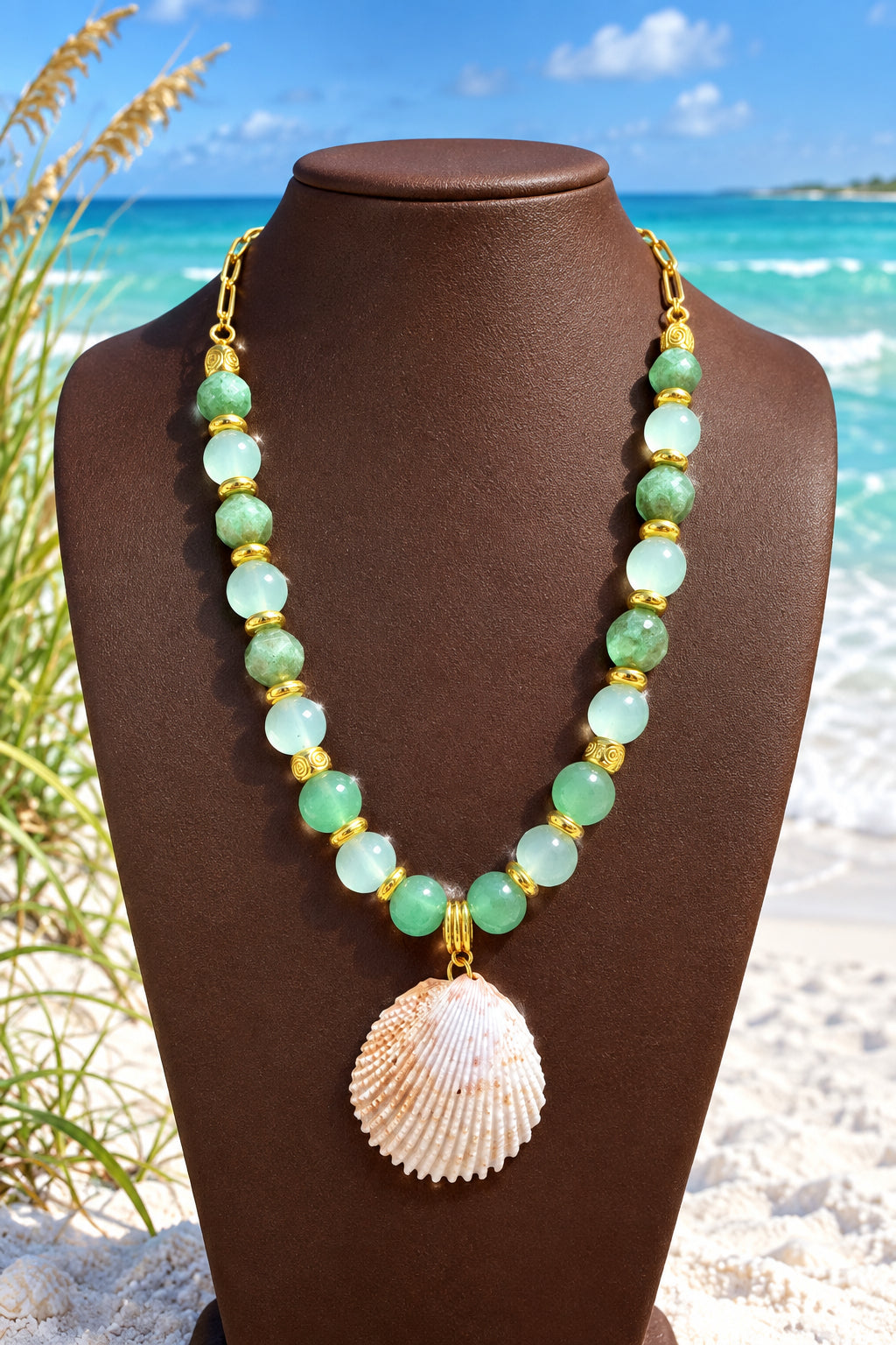 Green beaded necklace with natural shell pendant and gold-tone accents