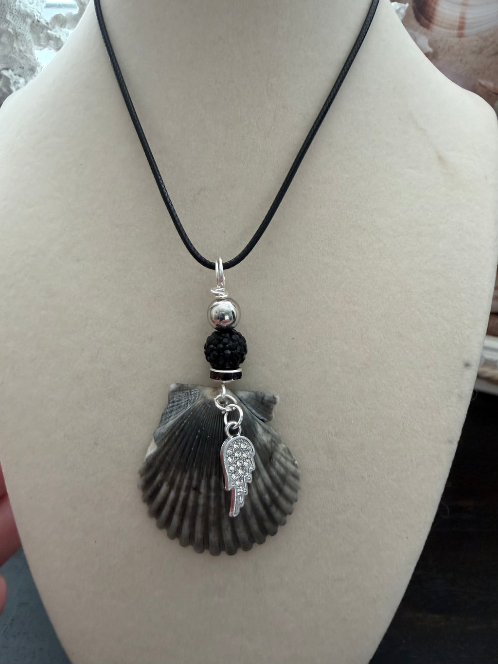 Dark Waters Scallop Shell Necklace – Crystal Wing Charm & Pavé on Black Cord