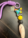 Be Kind Shore – Autism Awareness Shell & Butterfly Charm Wristlet