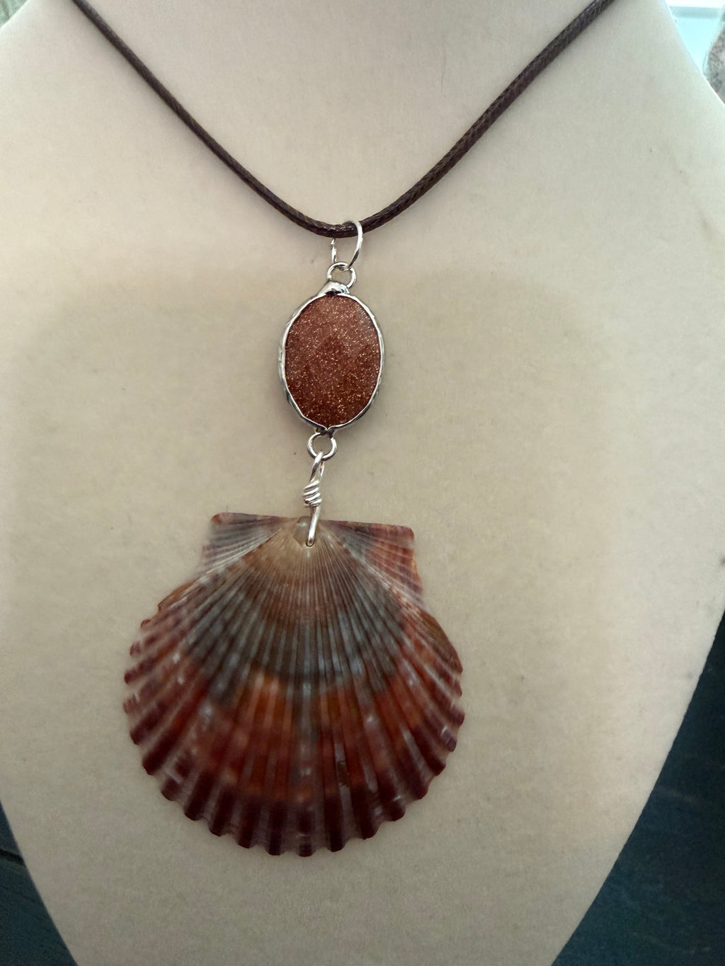 Burgandy Beach Sunset – Calico Scallop Shell & Goldstone Necklace on Brown Cord
