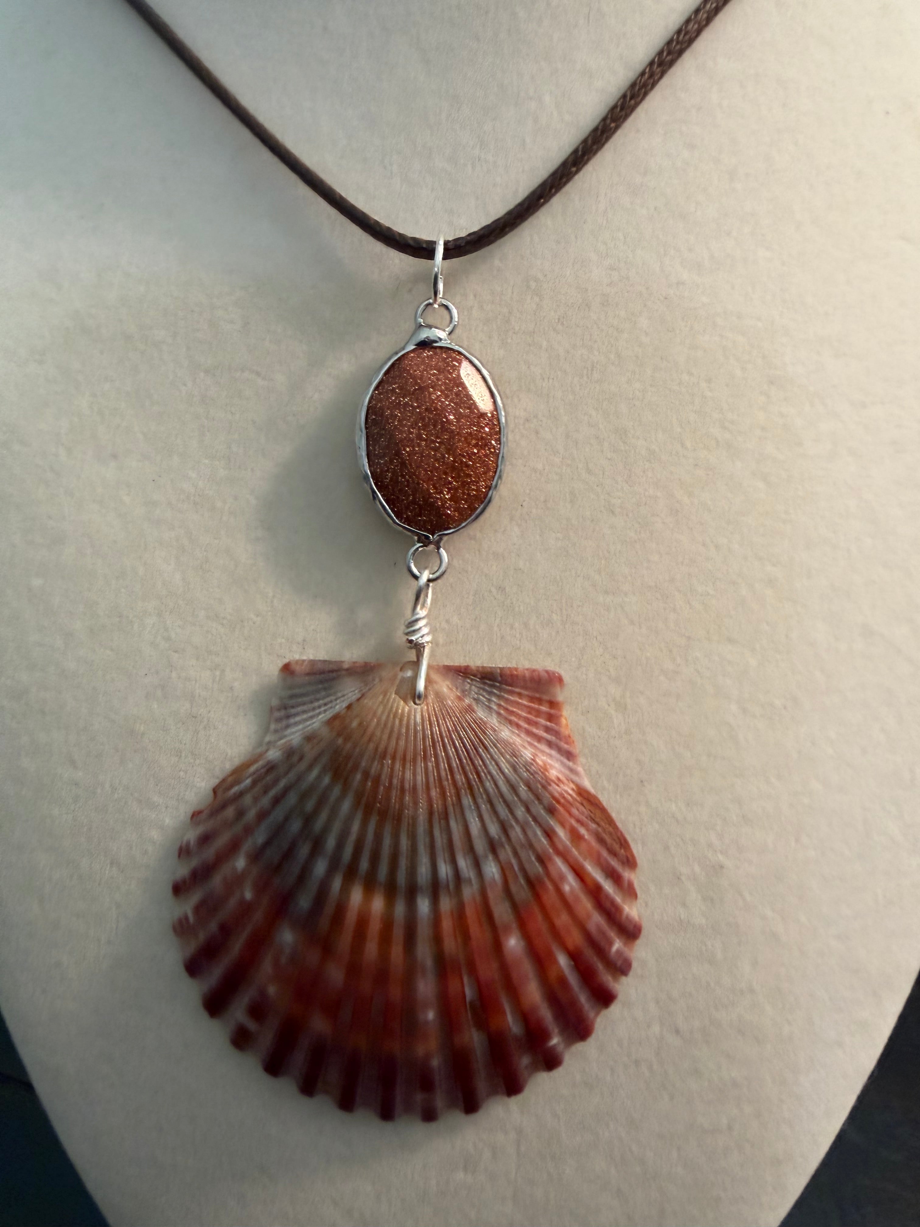 Burgandy Beach Sunset – Calico Scallop Shell & Goldstone Necklace on Brown Cord
