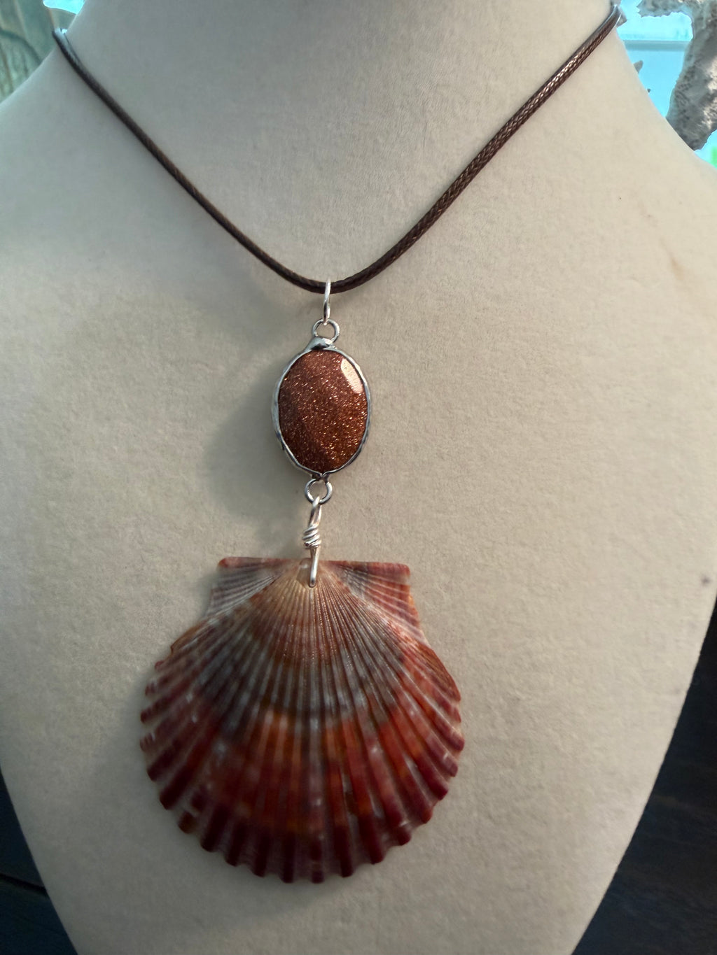 Burgandy Beach Sunset – Calico Scallop Shell & Goldstone Necklace on Brown Cord