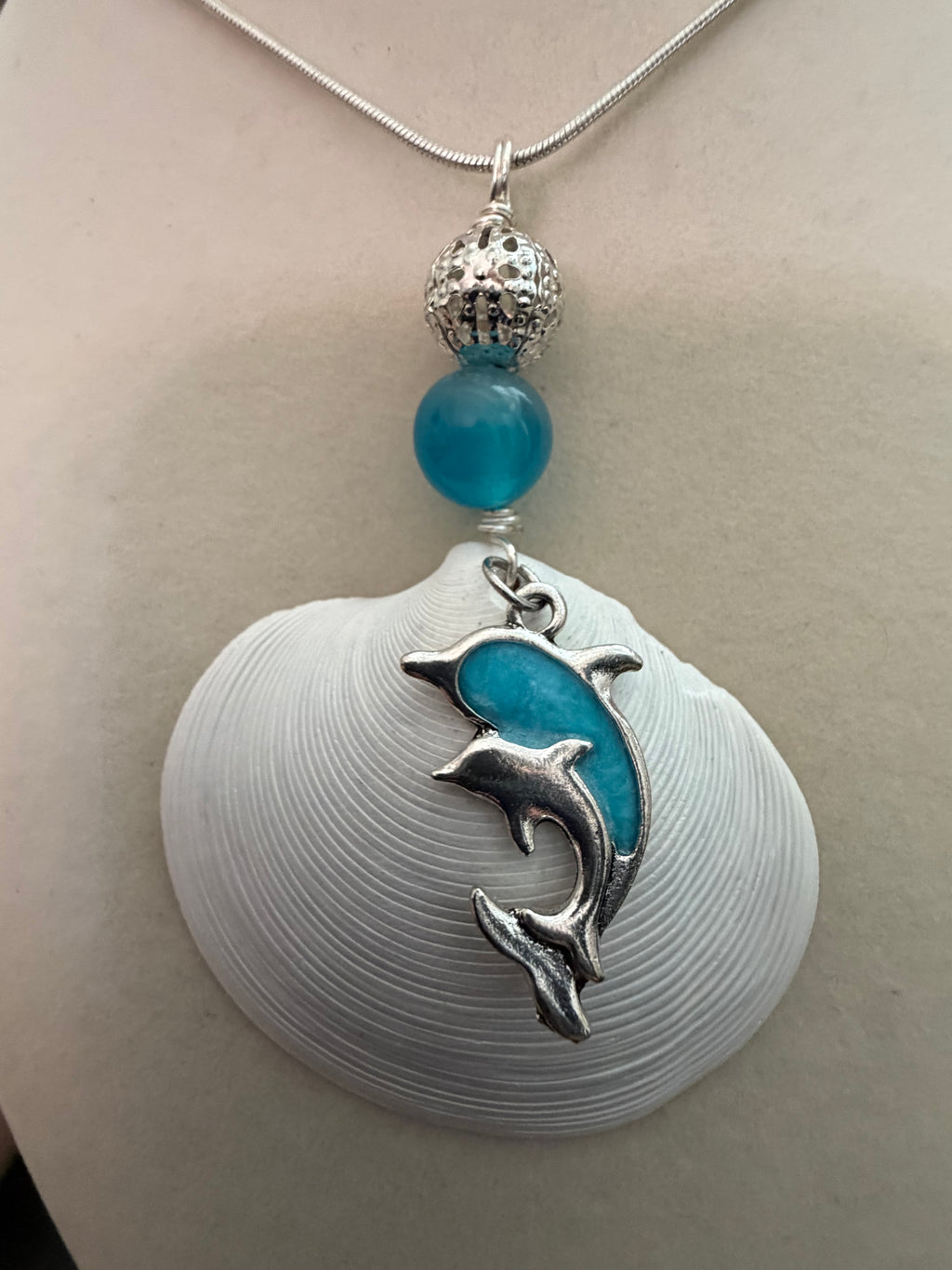 Dolphin Cove – White Disc Shell & Dolphin Charm Necklace on Silver Snake Chain