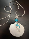 Dolphin Cove – White Disc Shell & Dolphin Charm Necklace on Silver Snake Chain