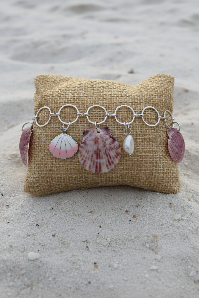 Shoreline Keepsakes shell charm bracelet with calico scallop shells, freshwater pearls, and seahorse on silver chain