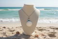 White Sand Dollar Necklace with Realistic Florida Beach Background